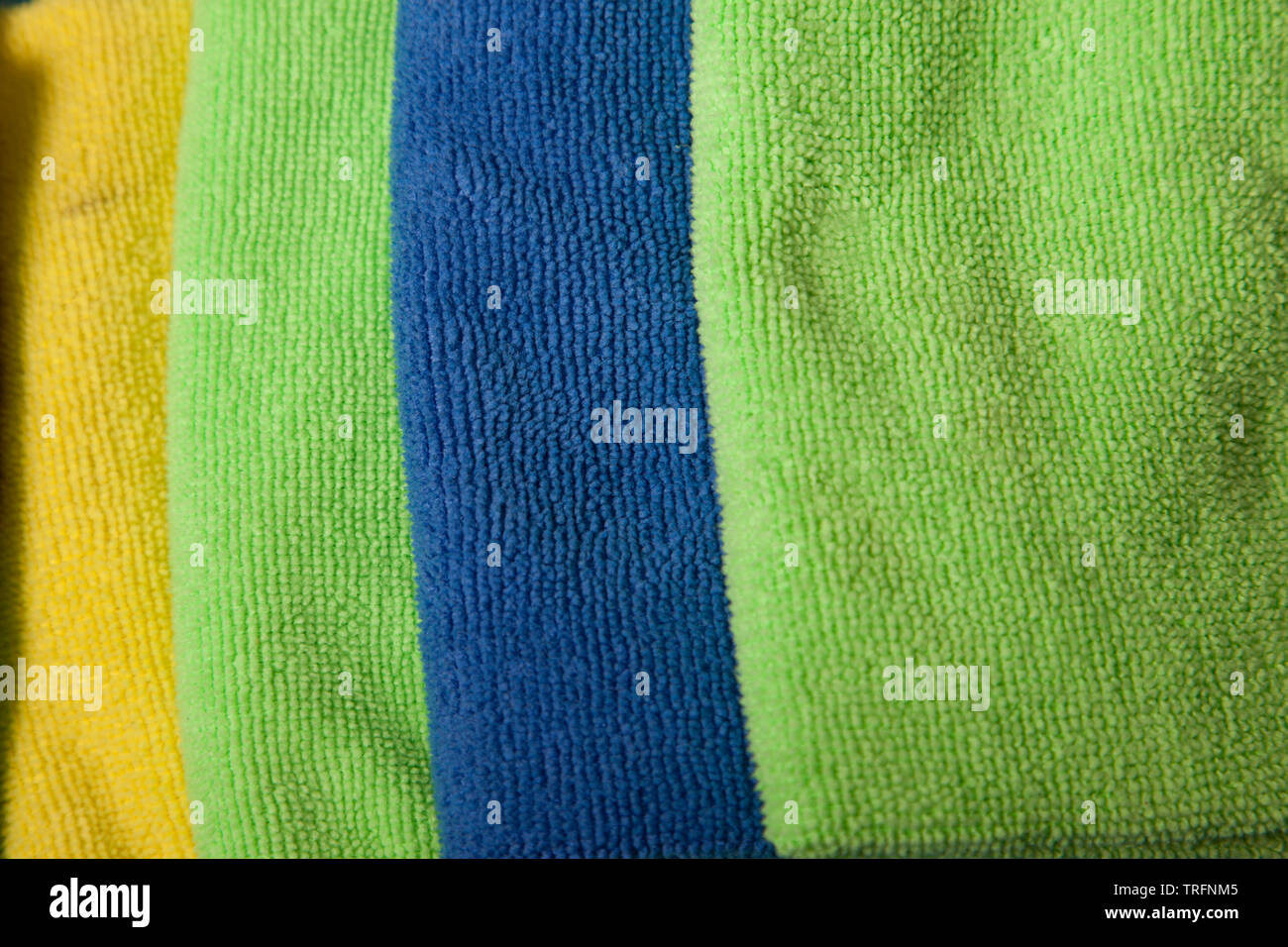 Green, yellow, and blue colored cloths shown close up Stock Photo
