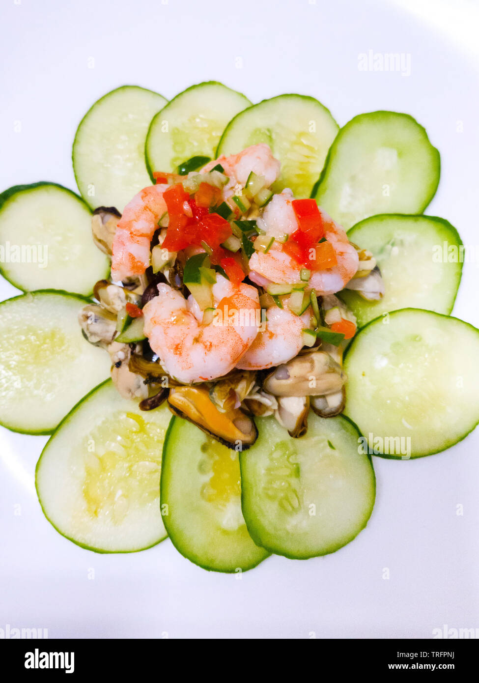 seafood salad decorated with cucumber Stock Photo
