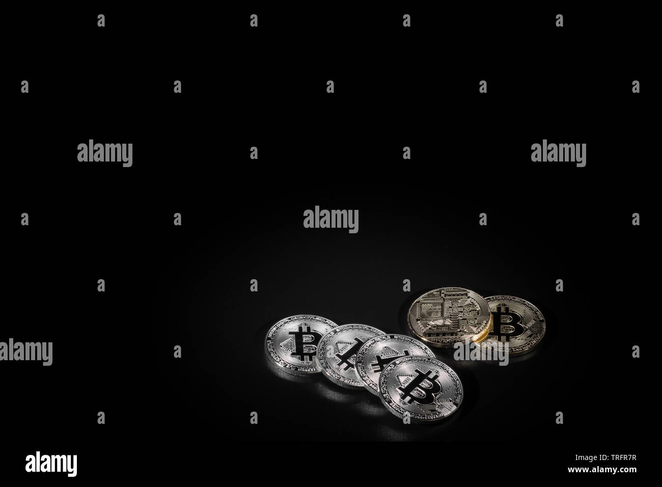 Golden bitcoins on the black background closeup. Cryptocurrency virtual  money. Exchange, anonymous Stock Photo - Alamy