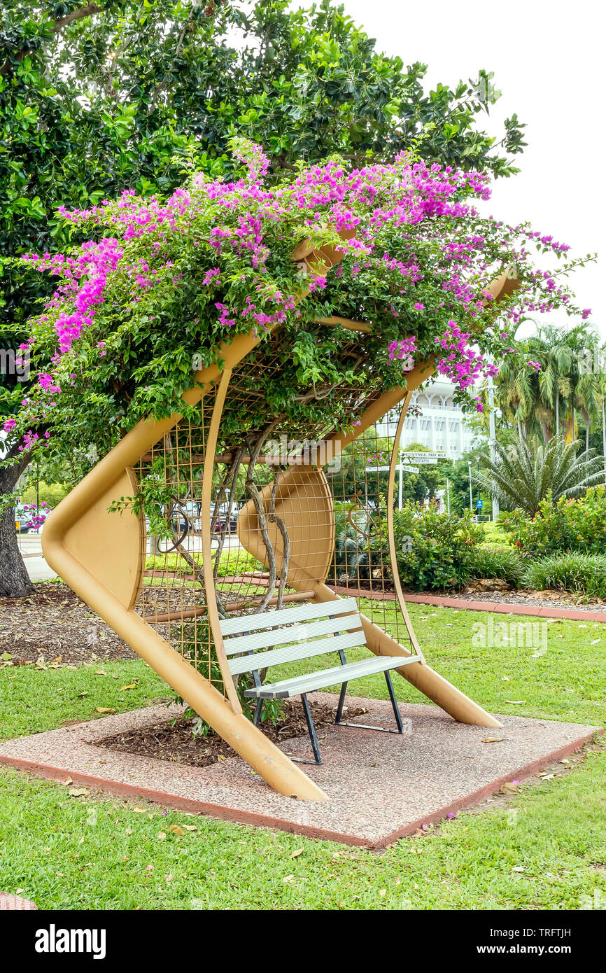 One of the beautiful bougainvillea-covered benches of Darwin's Bicentennial Park, Australia Stock Photo