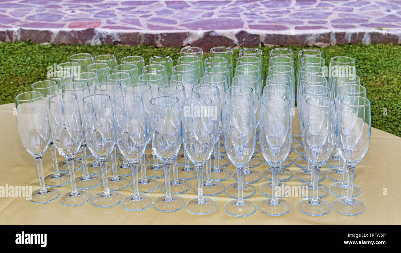 Many flute glasses ready to be used for outdoor celebrations Stock