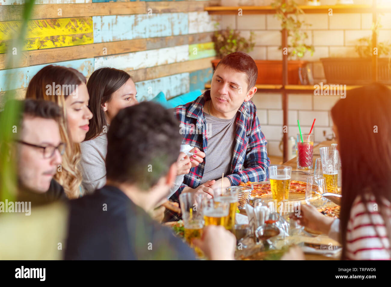 Happy friends group drinking beer at pub restaurant Stock Photo