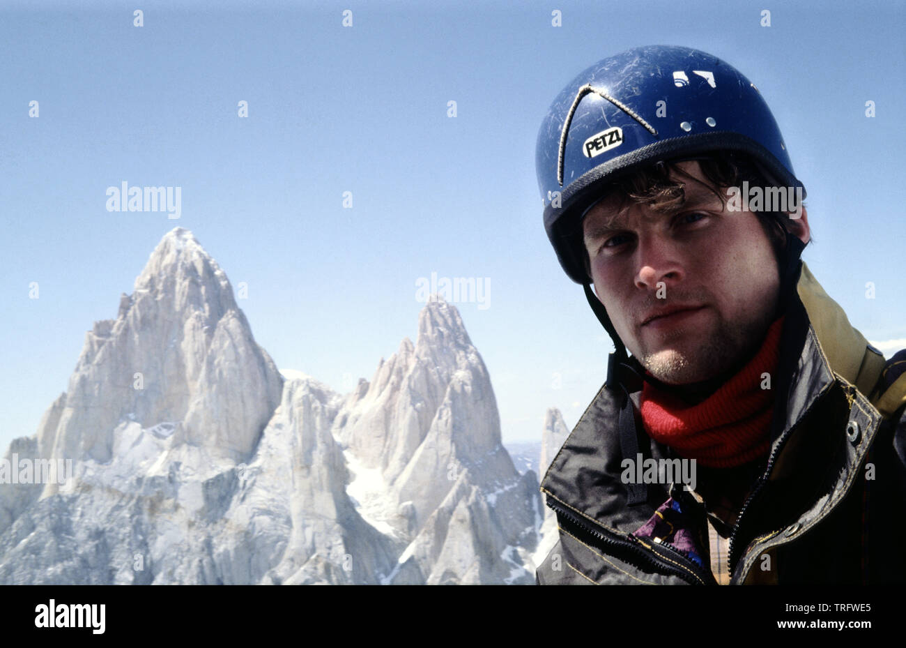 Outdoor photographer Øyvind Martinsen on a climb on the steep Cerro Torre mountain in Los glaciares national park in Patagonia, Argentina. Mount Fitz Roy is the background (left). January, 1993. Stock Photo