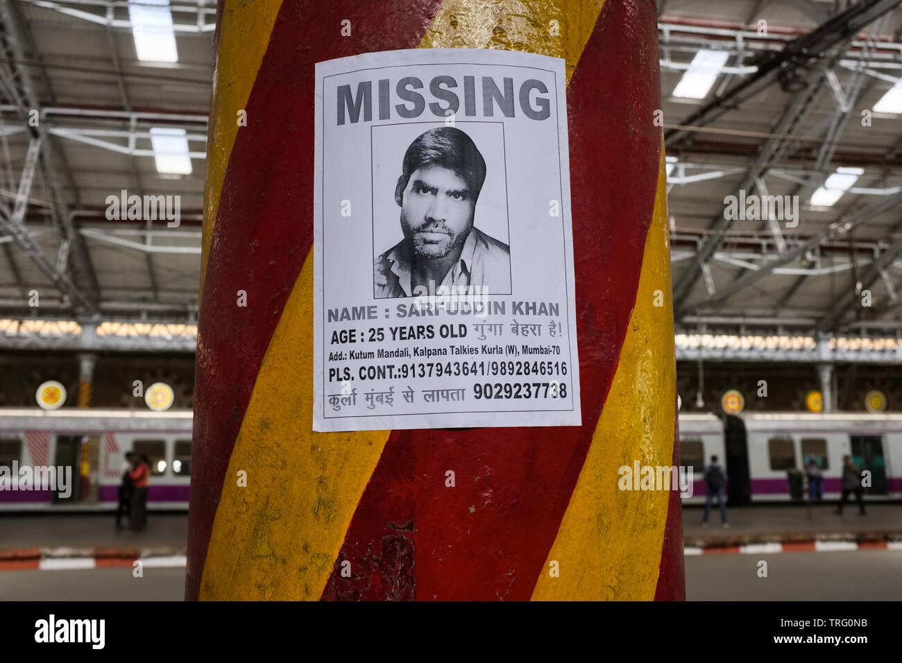 A Missing Person poster pasted on a pillar at Chhatrapati Shaivaji Maharaj Terminus, the busiest railway station in Mumbai , India Stock Photo