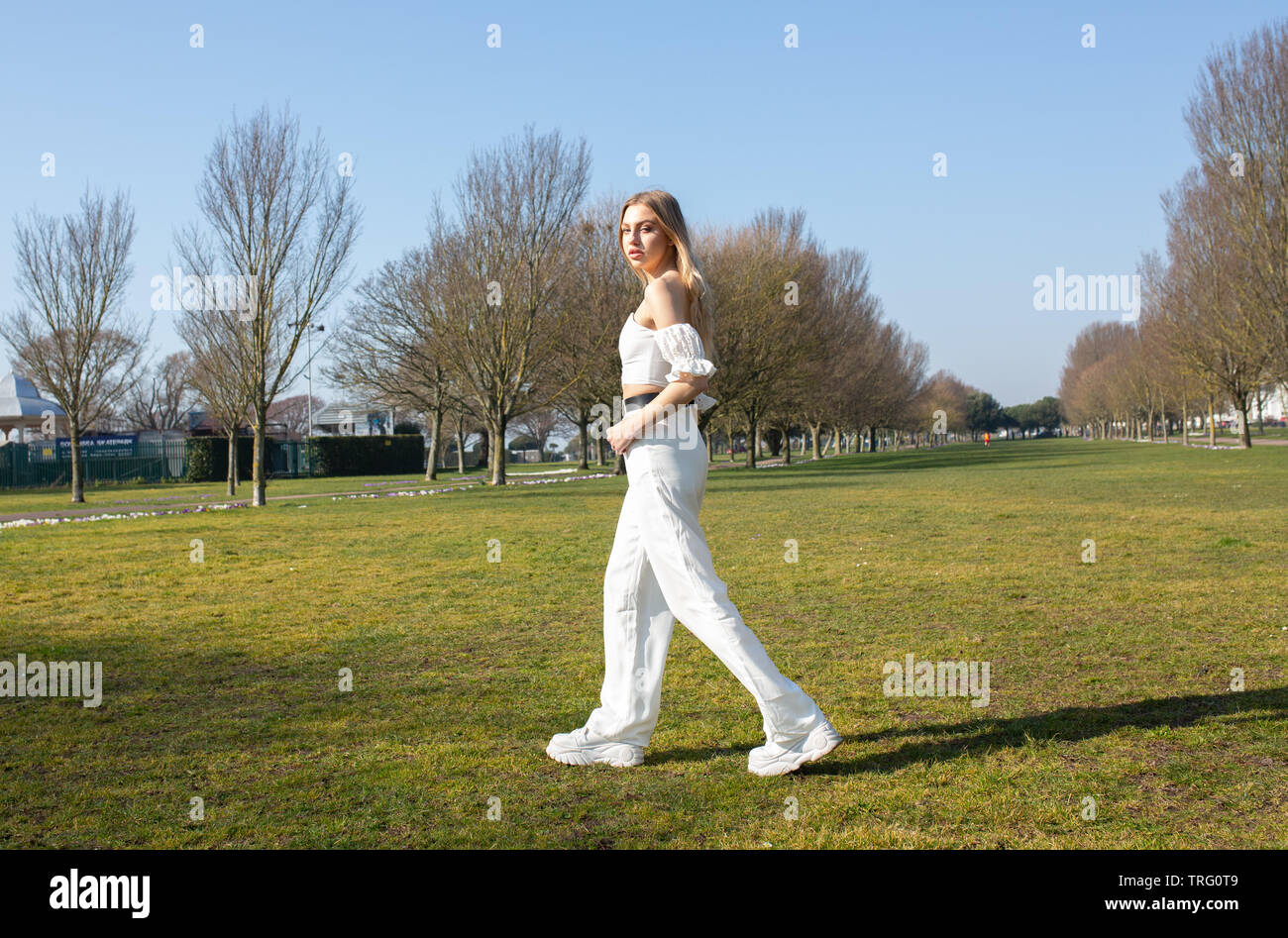 Teenage girl walking in the park posing Stock Photo Alamy