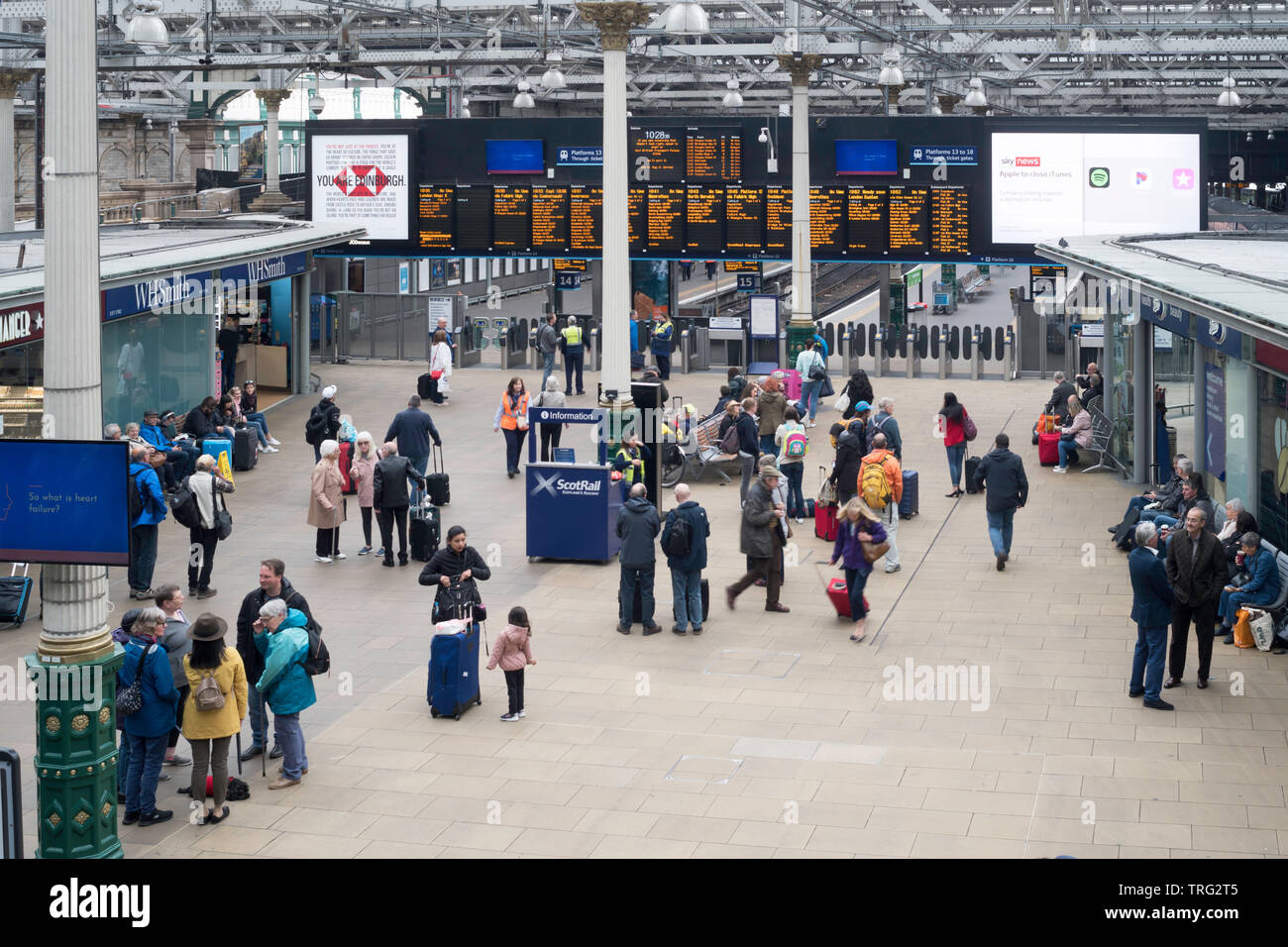 Passengers waiting in the concourse of Edinburgh Waverley railway