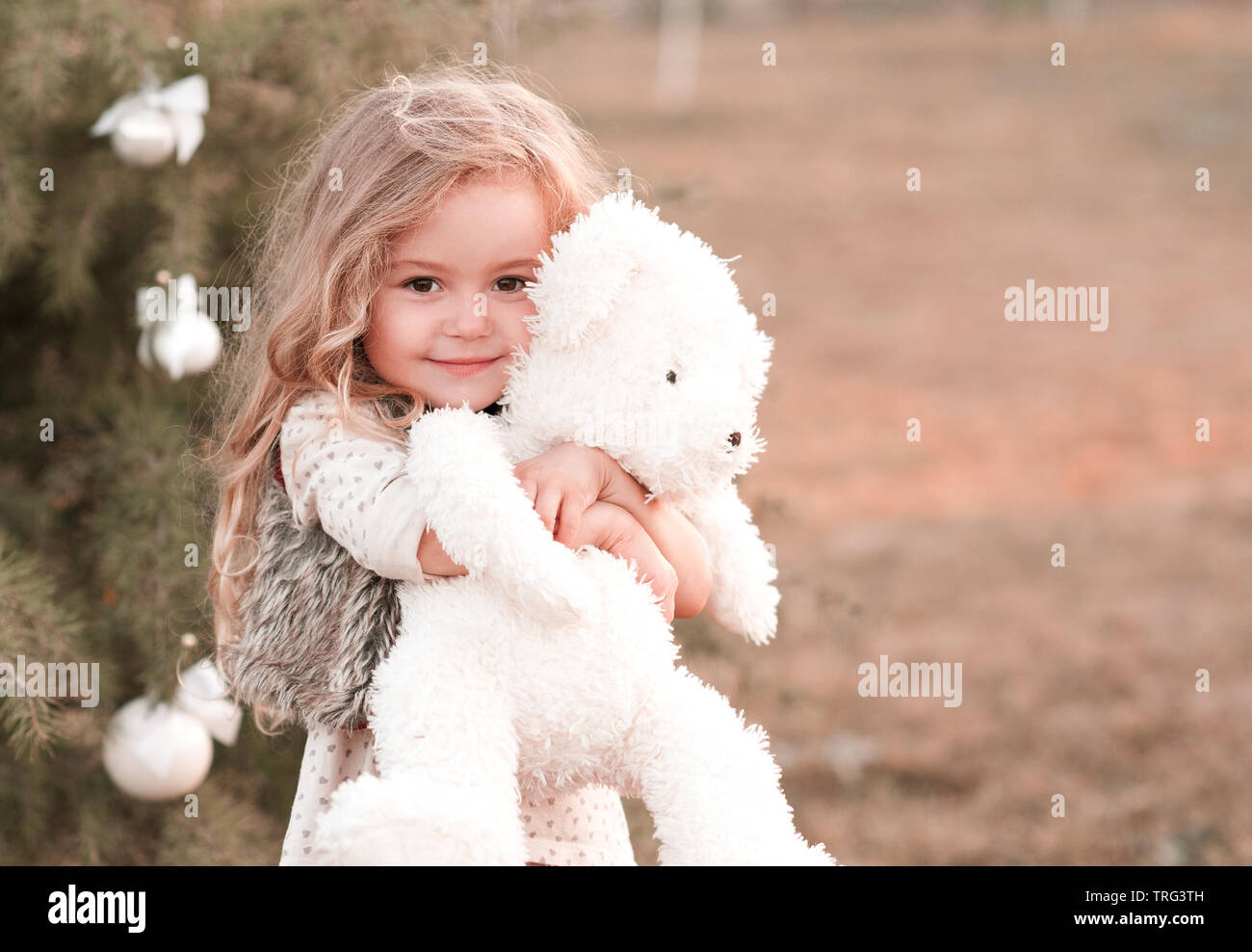 girl holding teddy bear