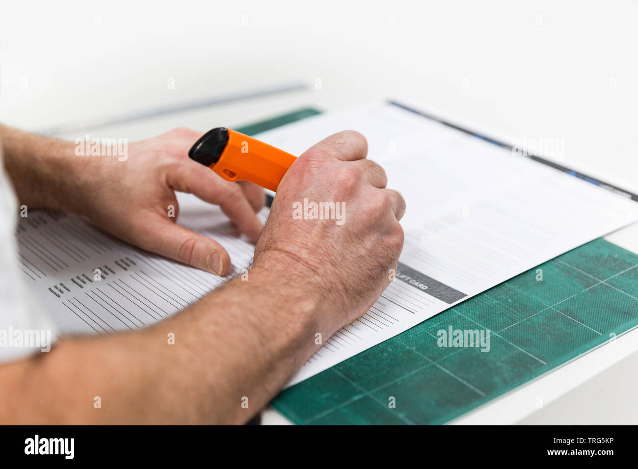 Printer cutting section through A4 sheet of paper Stock Photo Alamy