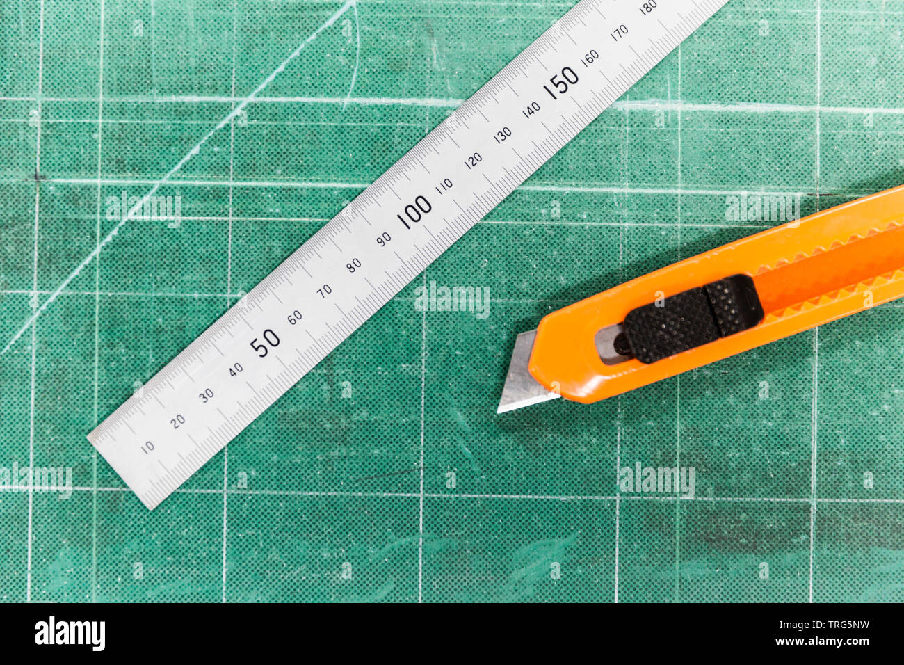 Printers cutting mat with ruler & Stanley knife ready for use Stock