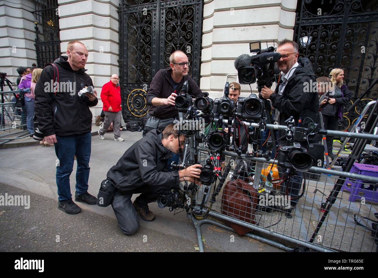Photographers set up remote control cameras opposite the door to number 10 ahead of the arrival of the President on Downing Street, Westminster, Londo Stock Photo