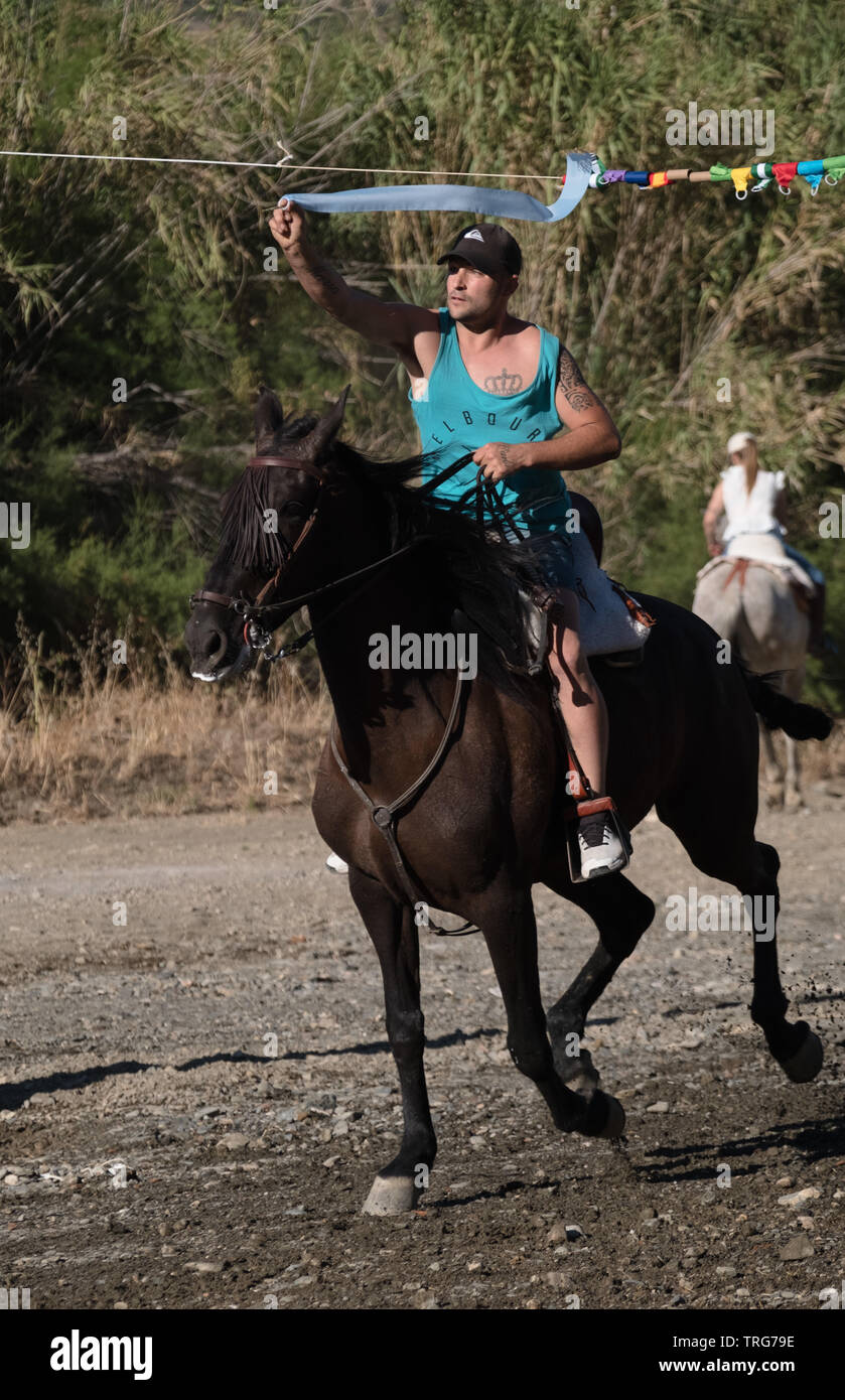 Traditional horse ribbon racing at the Benamargosa Romeria