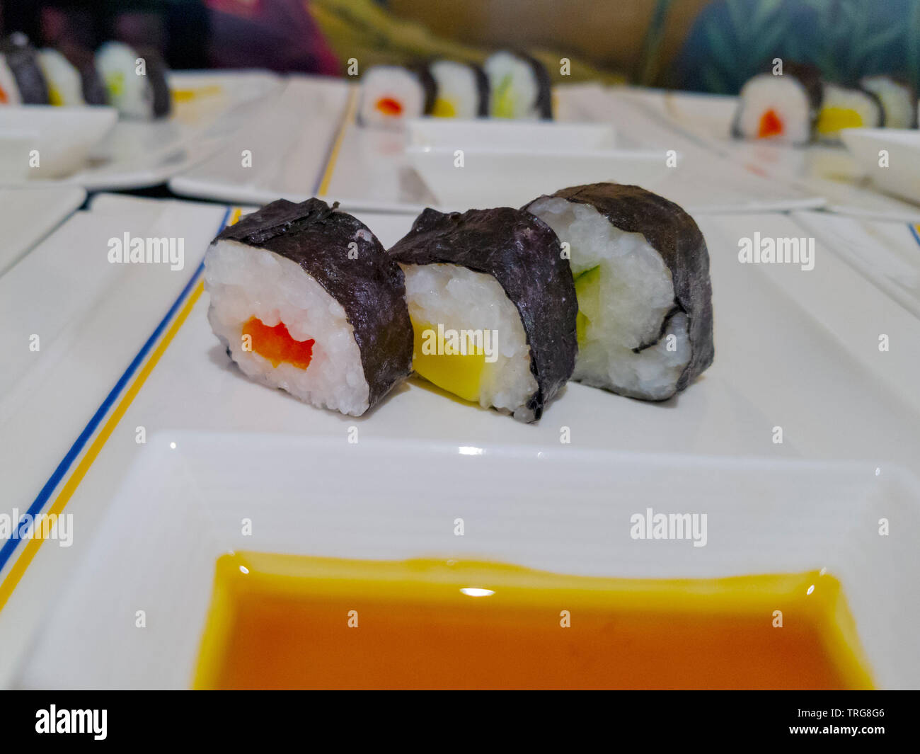 sushi prepared on white plates Stock Photo