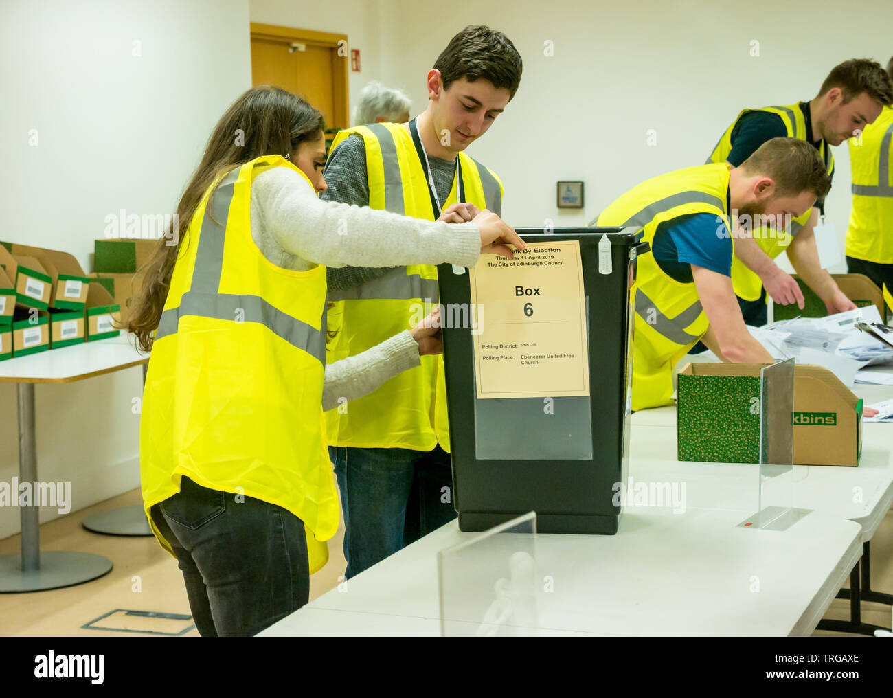 Leith Walk by-election count at Edinburgh City Council headquarters, Edinburgh, Scotland, UK with returning officer staff emptying ballot box Stock Photo
