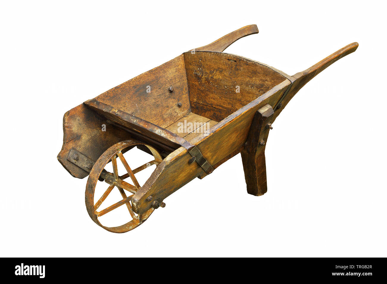 historic hamdmade wheelbarrow isolated over white background; thie is a rare barrow made of wood Stock Photo