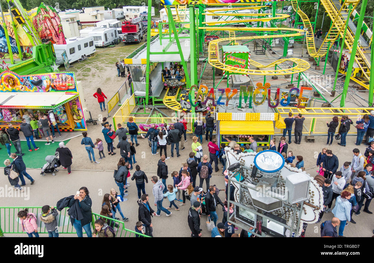 Wolfsburg, Germany, May 26., 2019: View from above of the fair at the Schützenfest in Wolfsburg with many people visiting the rides, lottery stalls an Stock Photo