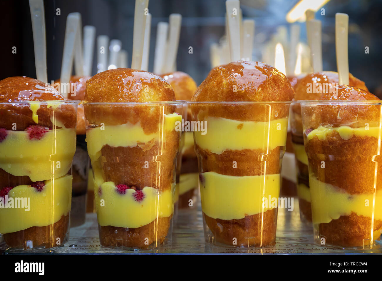 Babà, a typical Neapolitan pastry, made from flour, butter, sugar, yeast  and eggs. Usually impregnated with liquor rum. Babà, with yellow cream  Stock Photo - Alamy
