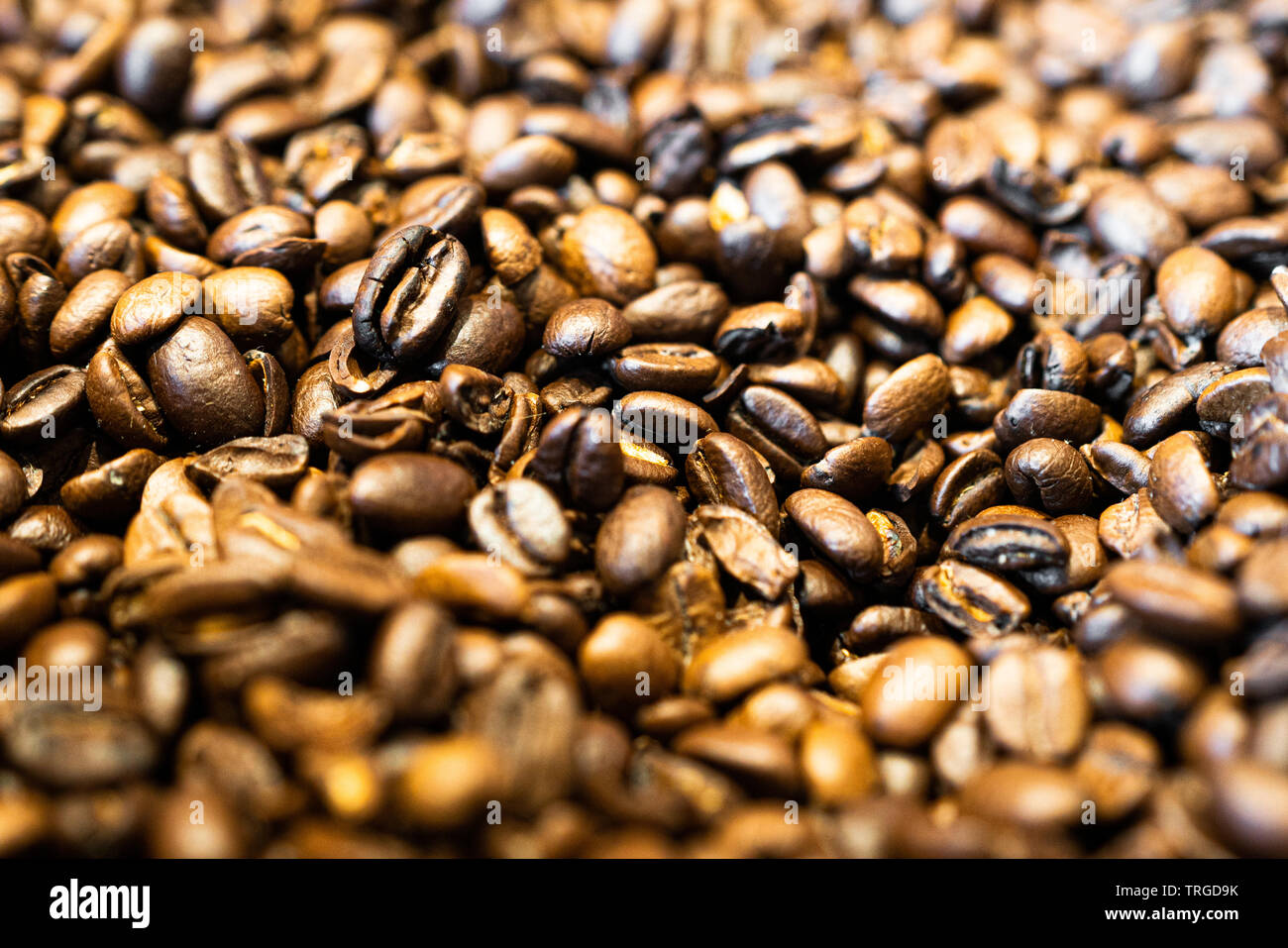 Roasted coffee beans background close up view Stock Photo