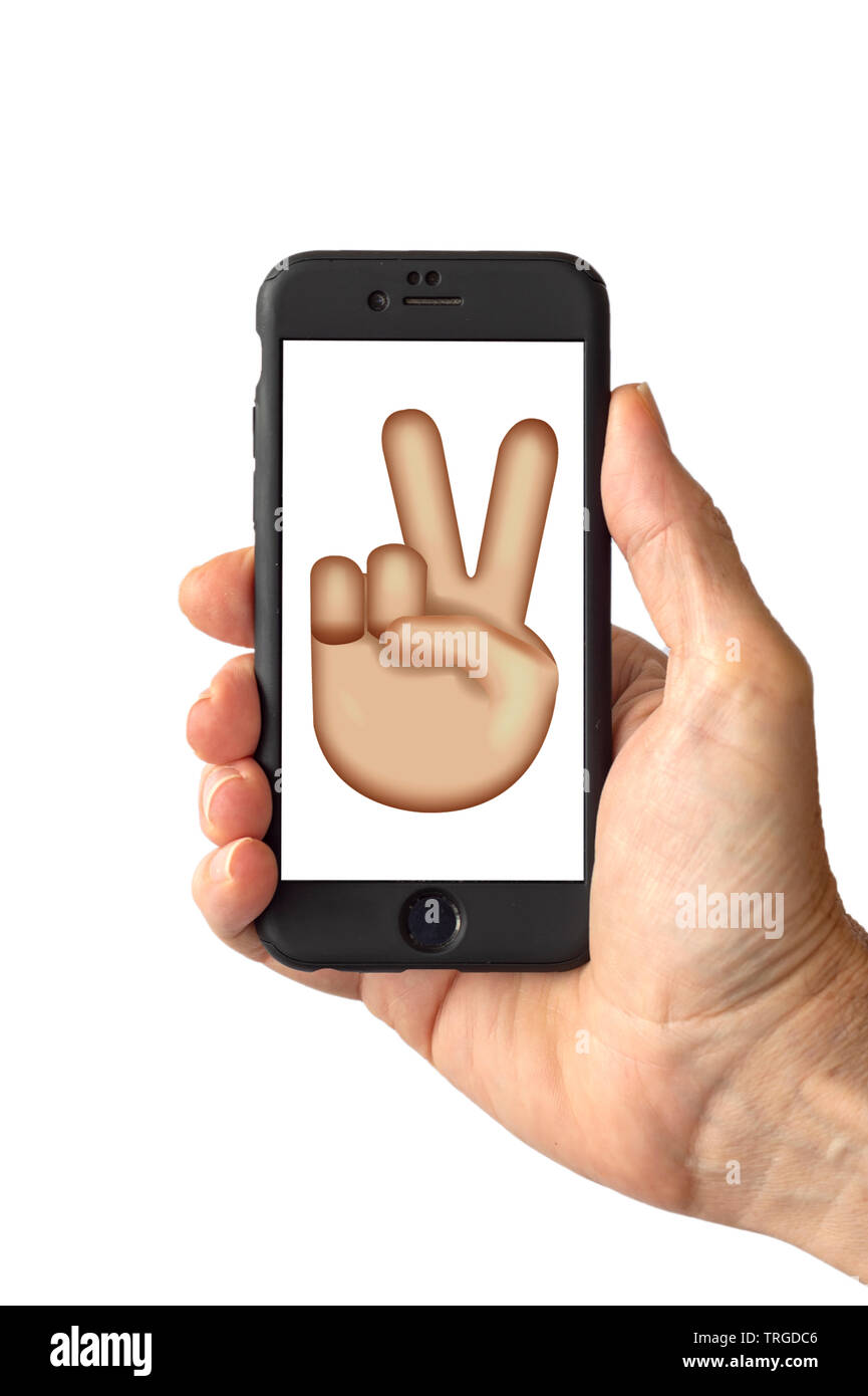 Victory Hand Emoji on a smartphone screen Stock Photo