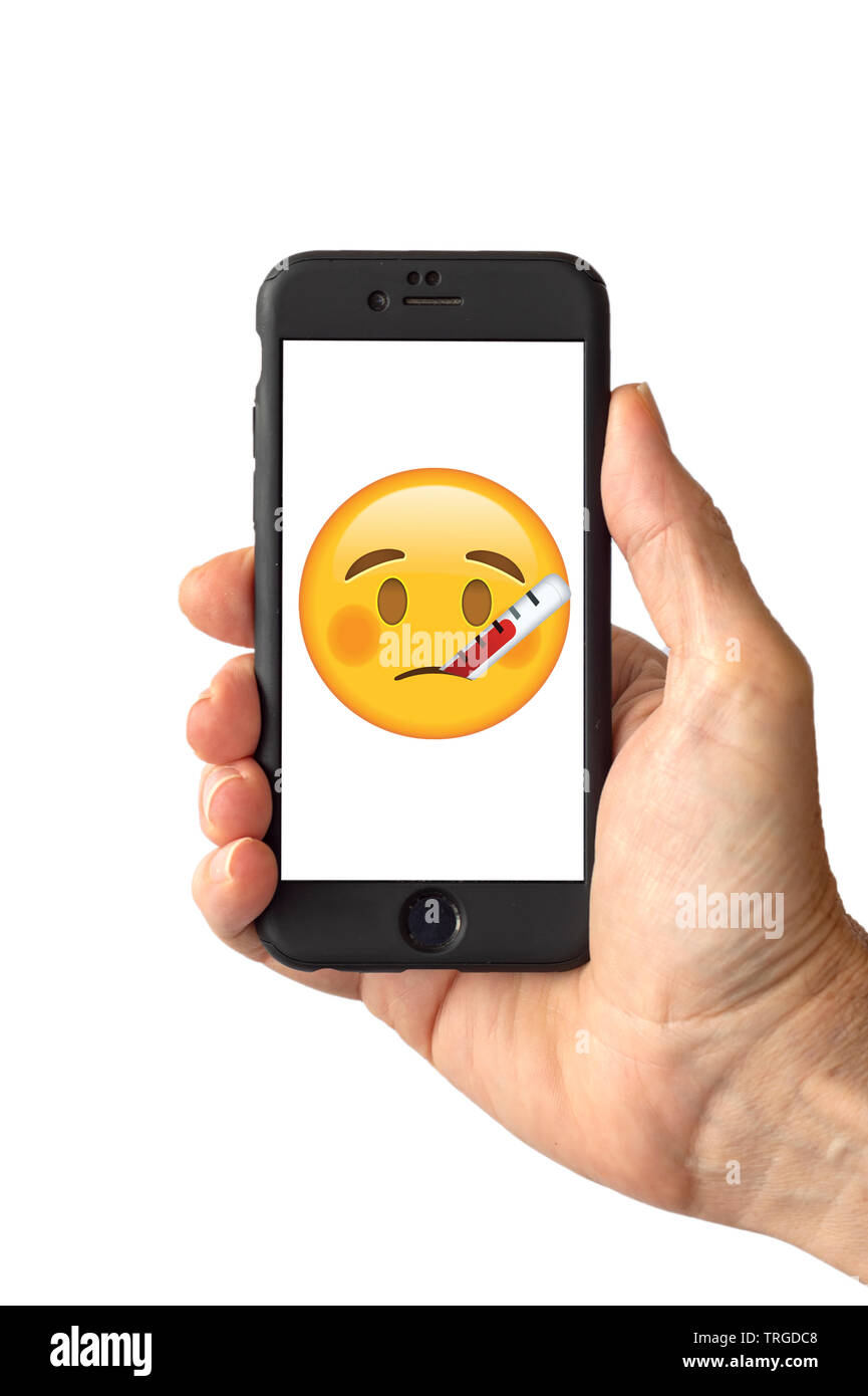Face With Thermometer Emoji on a smartphone screen Stock Photo