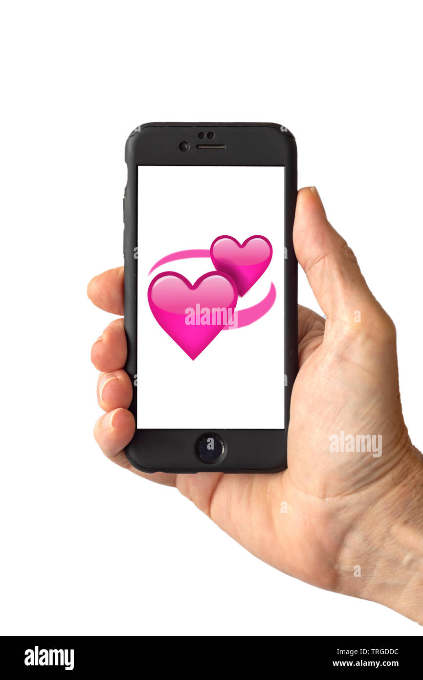 Two pink hearts emoji on a smartphone screen Stock Photo