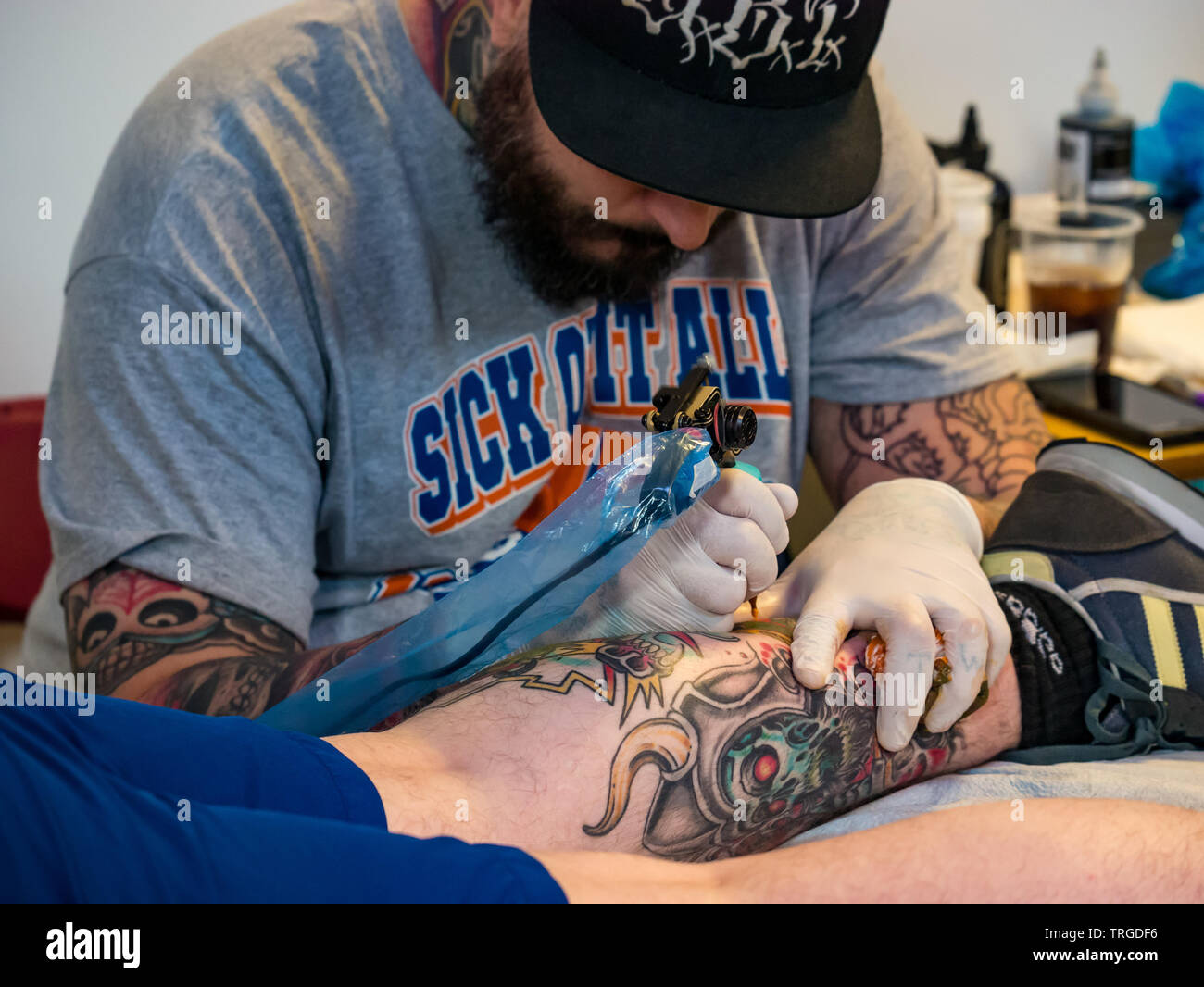 Corn Exchange, Edinburgh, Scotland, UK, 9th Annual Scottish Tattoo  Convention: Enthusiasts and tattoo artists with attendee getting a tattoo  Stock Photo - Alamy