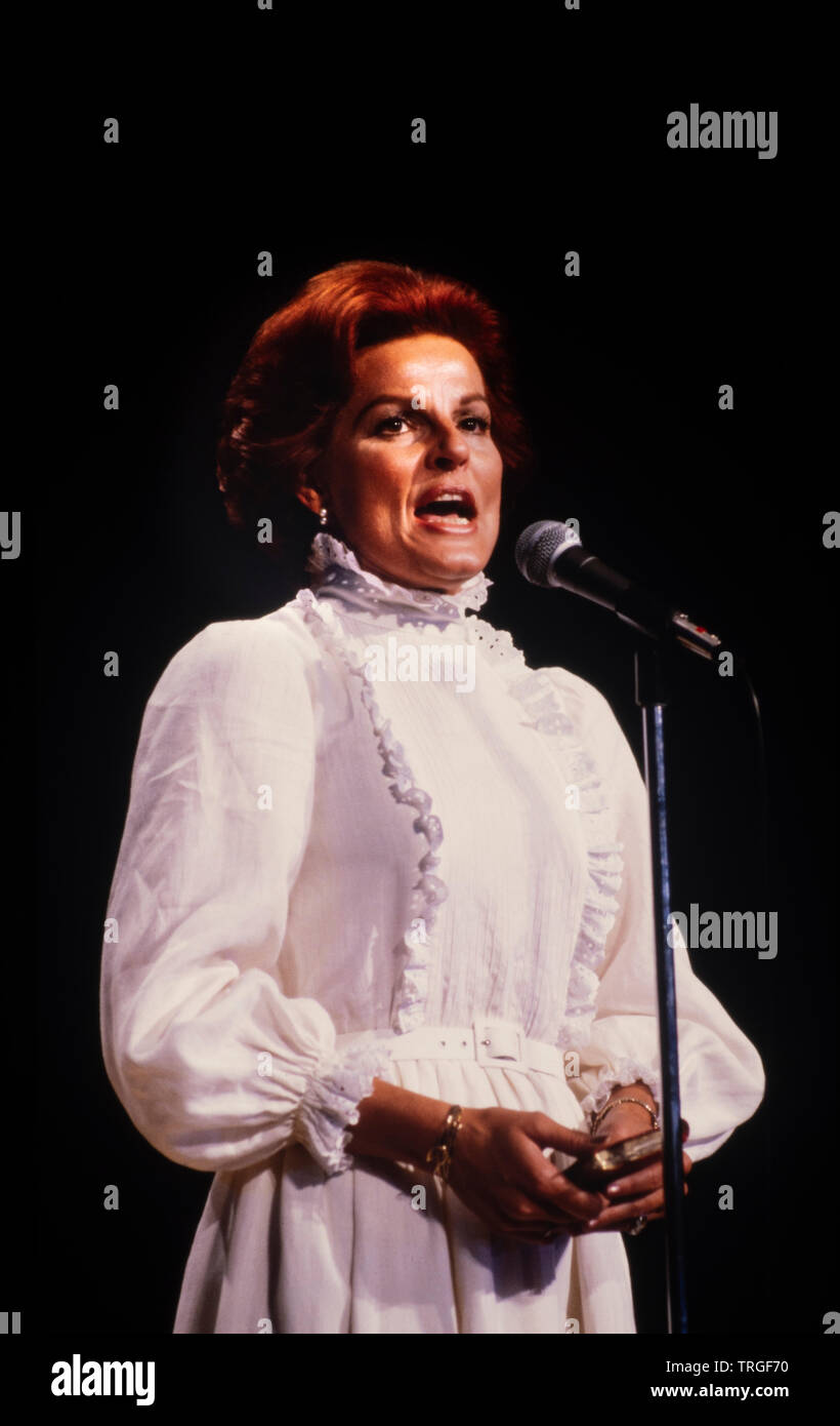 Anita Bryant holds New Testament Bible as she sings before a Christian gathering in Atlanta Georgia. Stock Photo