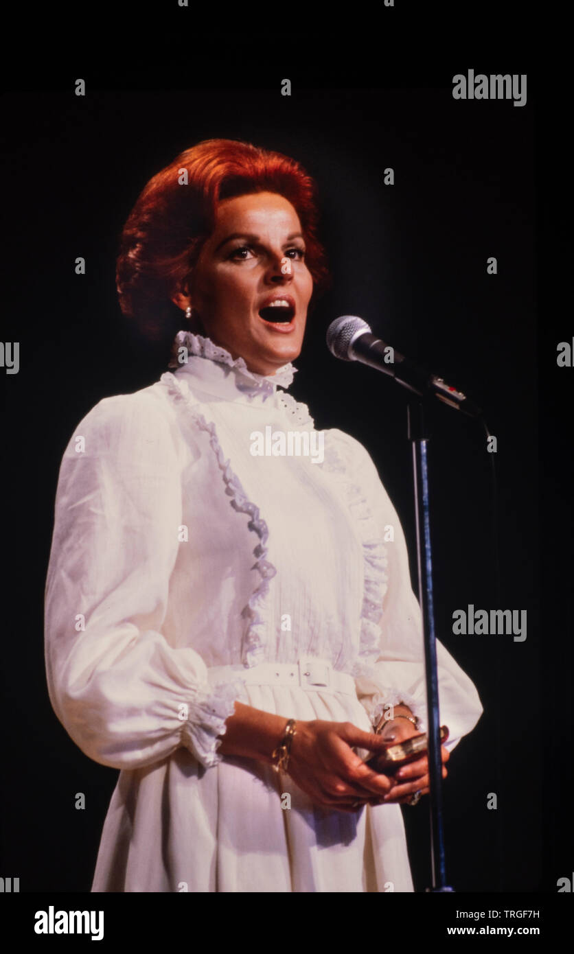 Anita Bryant holds New Testament Bible as she sings before a Christian gathering in Atlanta Georgia. Stock Photo