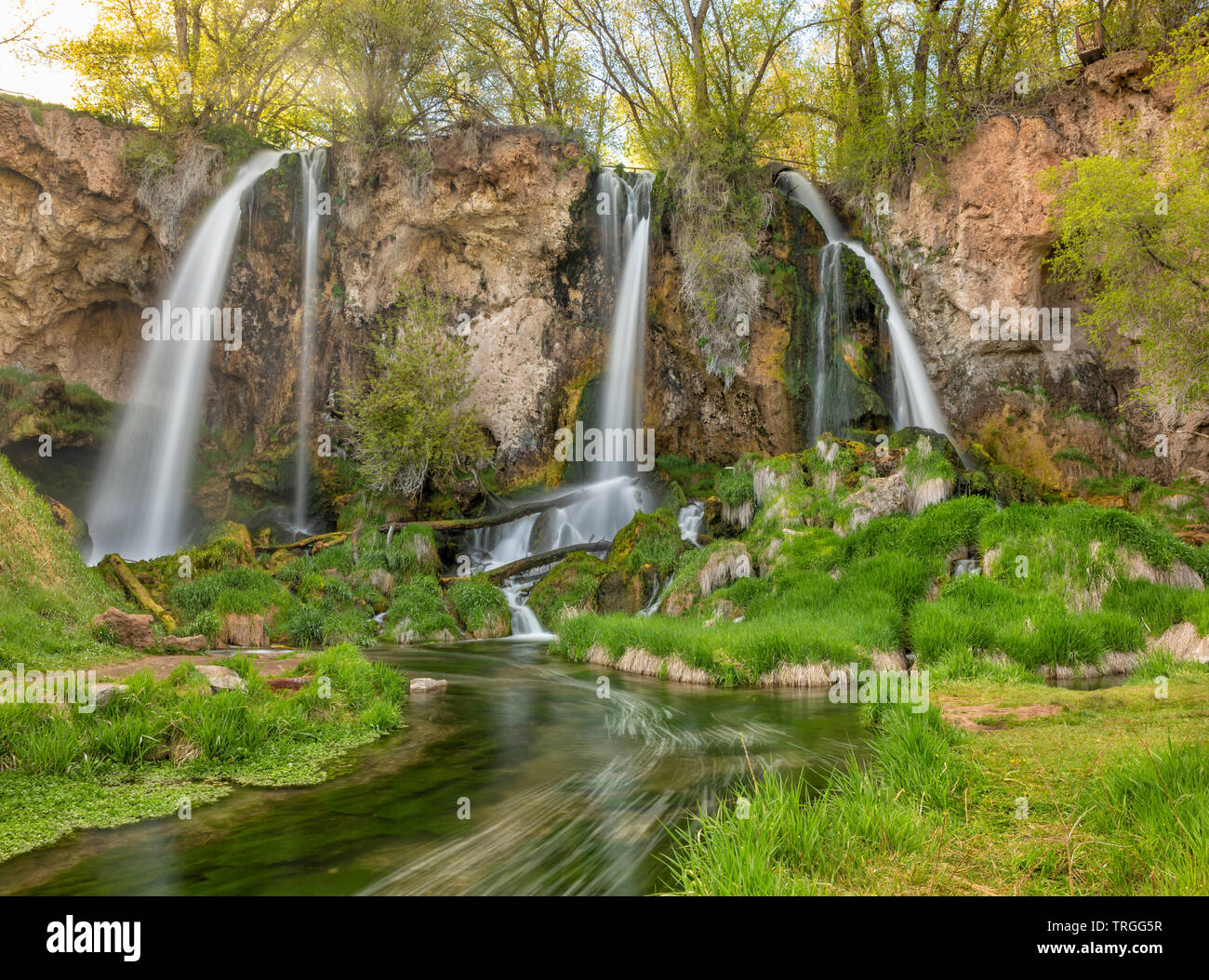 A long exposure of a triple falls at Rifle Falls in the lush Springtime, in Rifle Falls State Park, Colorado. Stock Photo