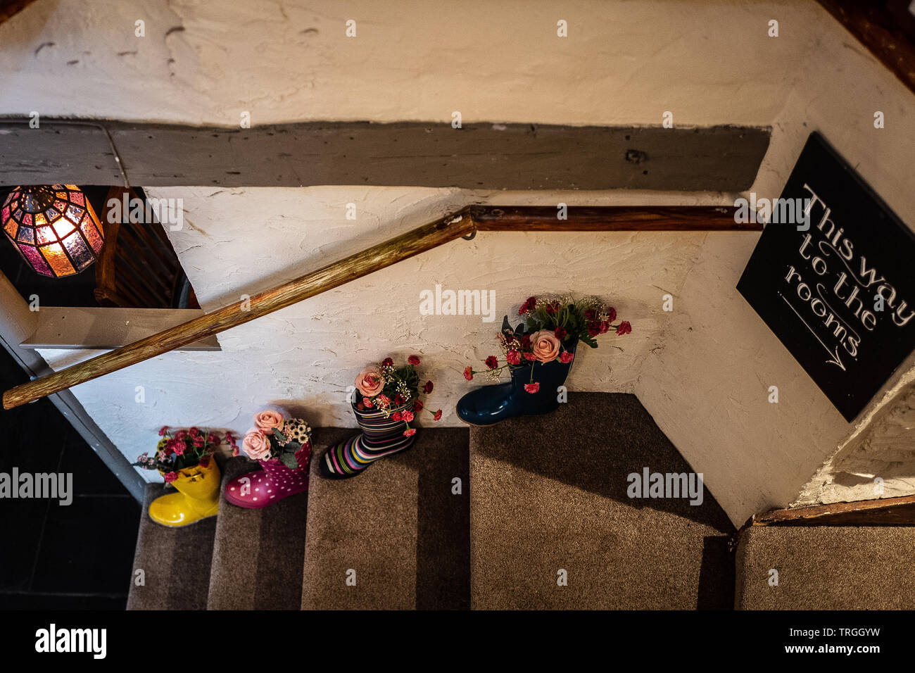 Quirky stairs and wellies Stock Photo