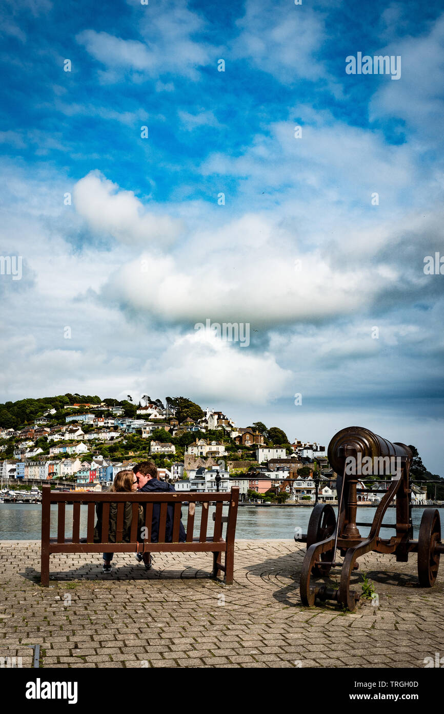 Kissing couple by the sea Stock Photo