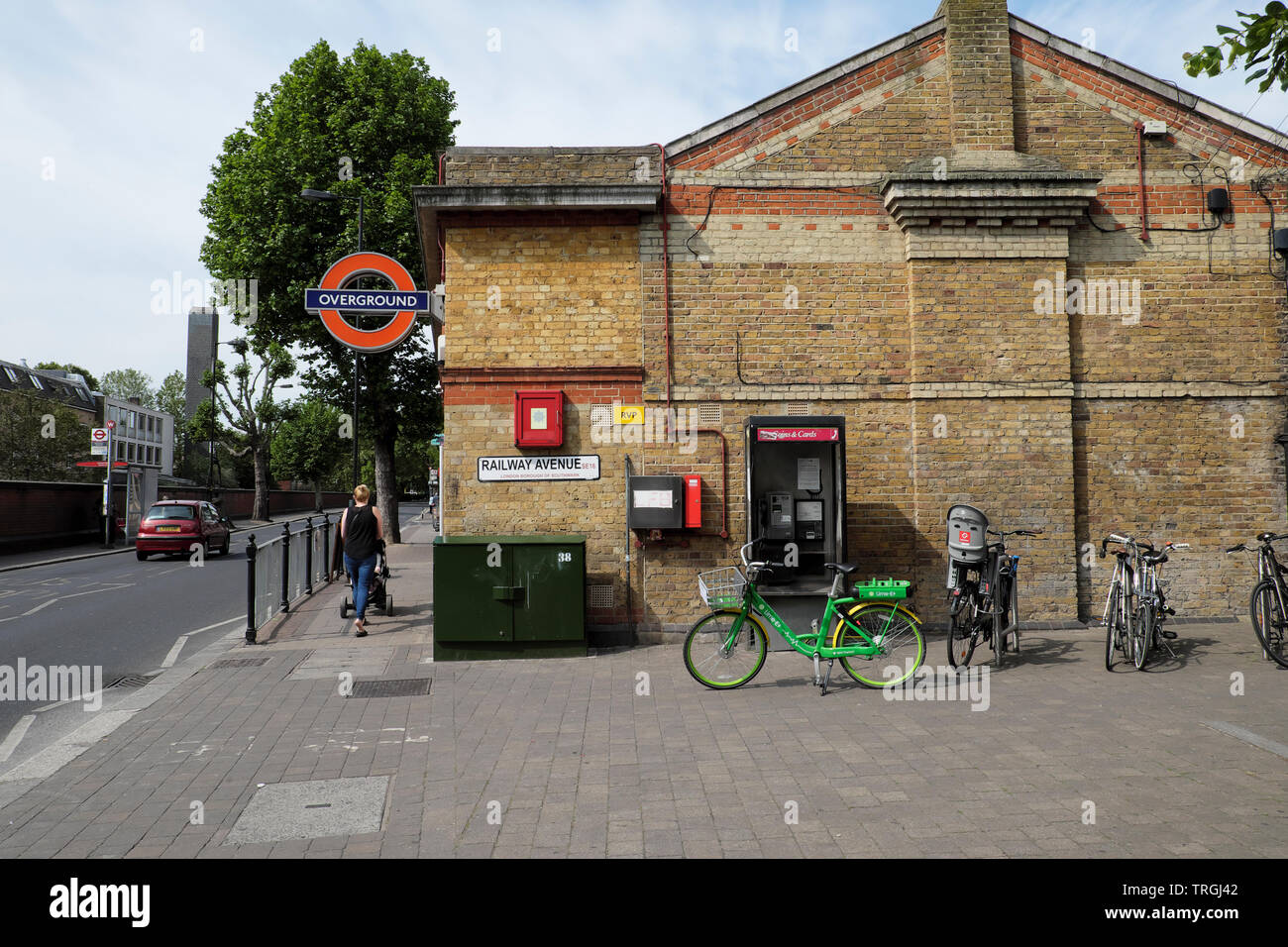E bike outside Rotherhithe Overground Station in South London UK  KATHY DEWITT Stock Photo