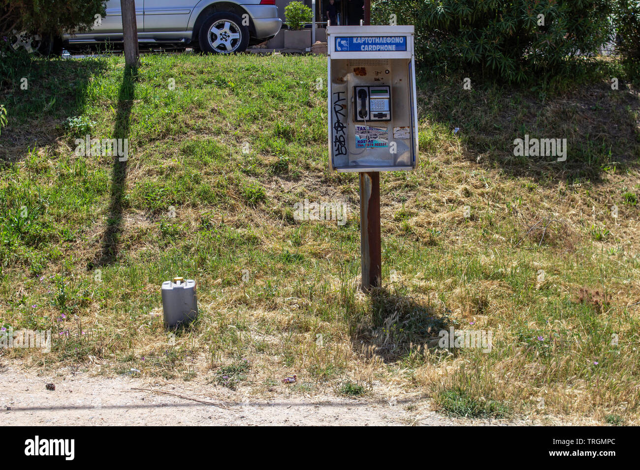 A card activated public telephone near the harbour at Nea Potidea, Halkidiki , Greece. Stock Photo
