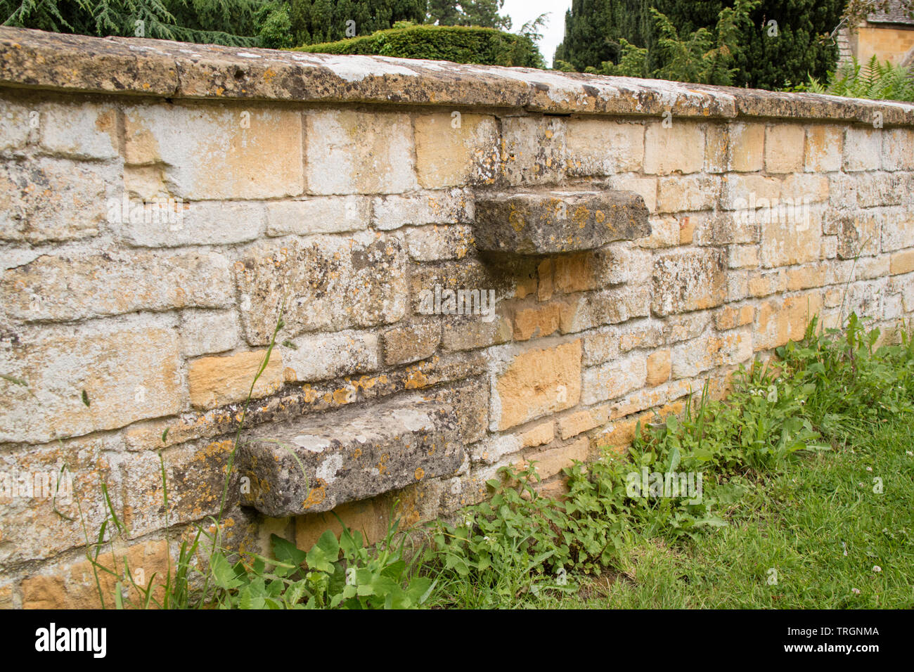 Stone steps inseted into a cotswold wall, the Cotswolds, England, UK Stock Photo
