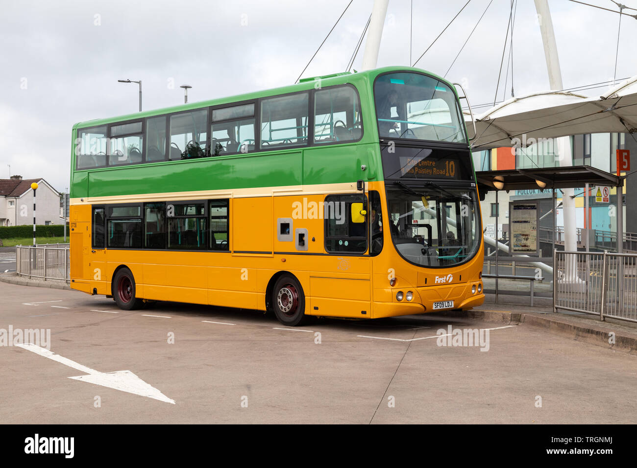 To celebrate 125 years of public transport in Glasgow First Bus have painted a Volvo B9TL bus in the retro Glasgow Corporation orange and green livery Stock Photo