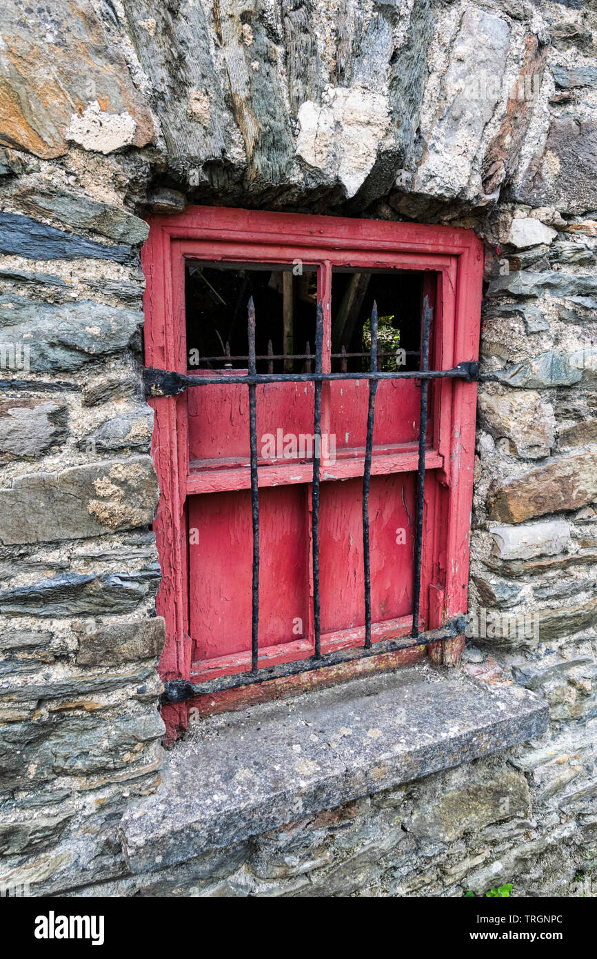 Old red wooden window on a stone wall of an abandoned building Stock ...