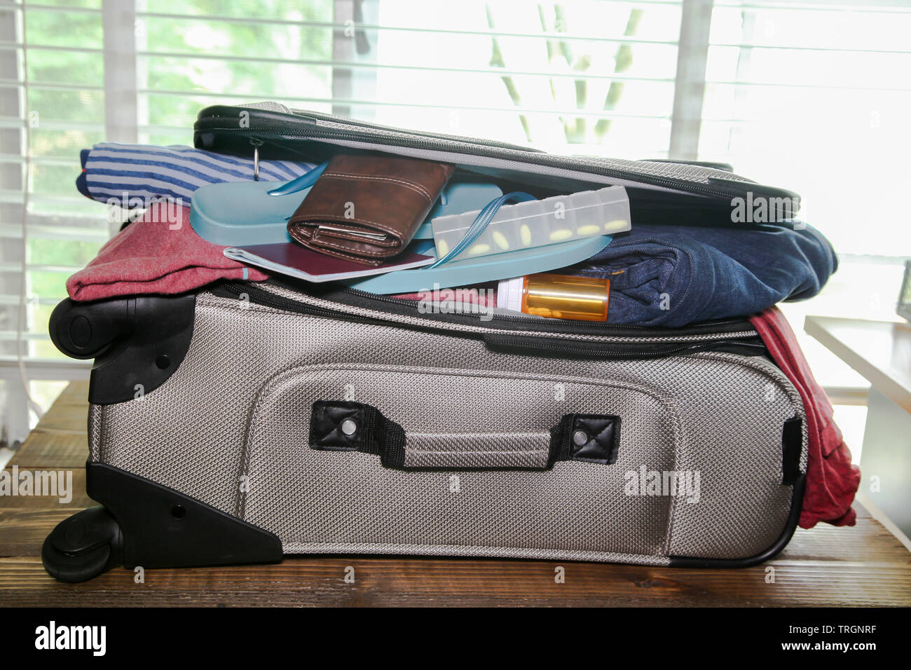 Full suitcase packed for vacation without more space Stock Photo Alamy