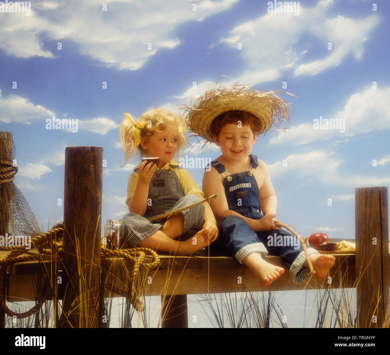 Two boys fishing at dock hi-res stock photography and images - Alamy