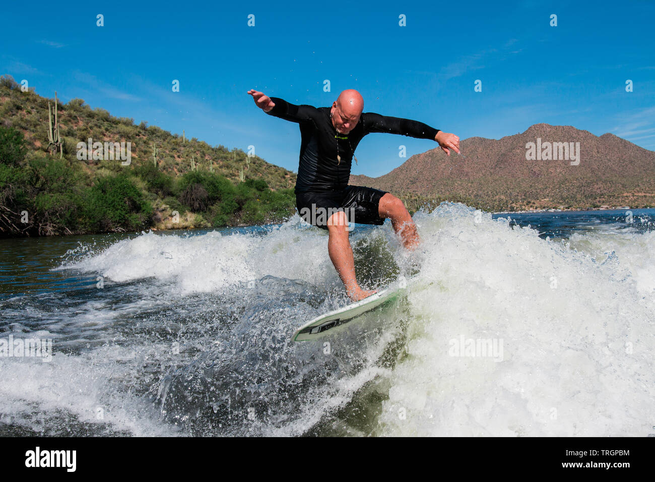 wake surfing wake surfers at the lake Stock Photo Alamy
