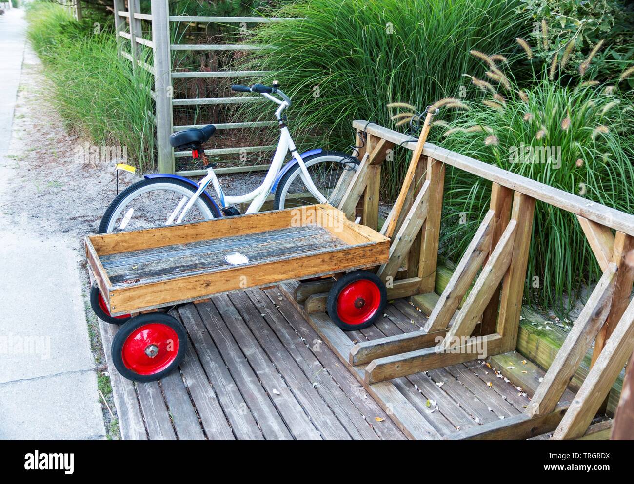 A bicyle and wagan are parked in front of a summer home in Ocean Beach on Fire Island New York. Stock Photo