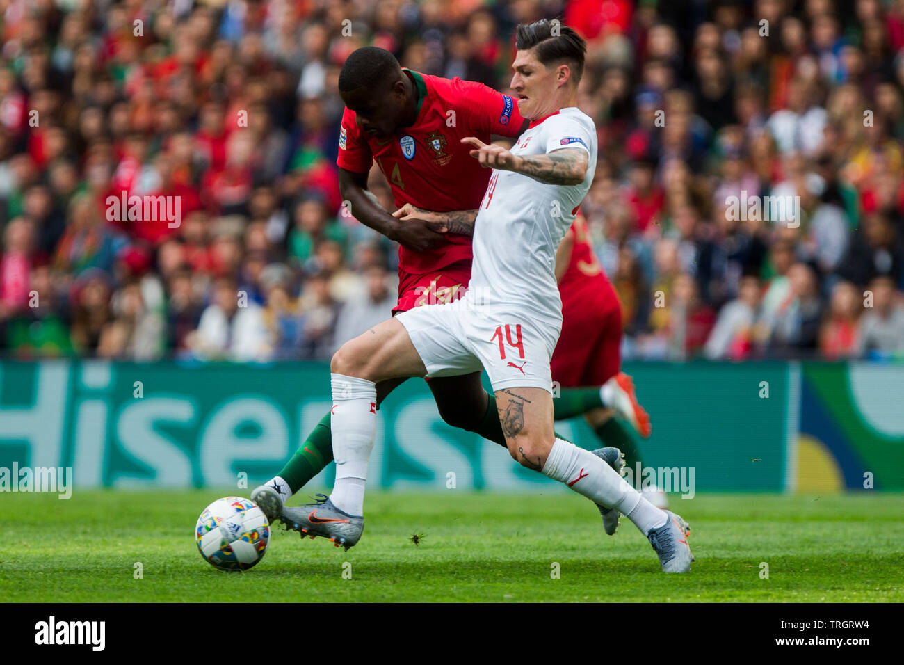 William Carvalho of POR tackles St. Zuber of SUI Stock Photo