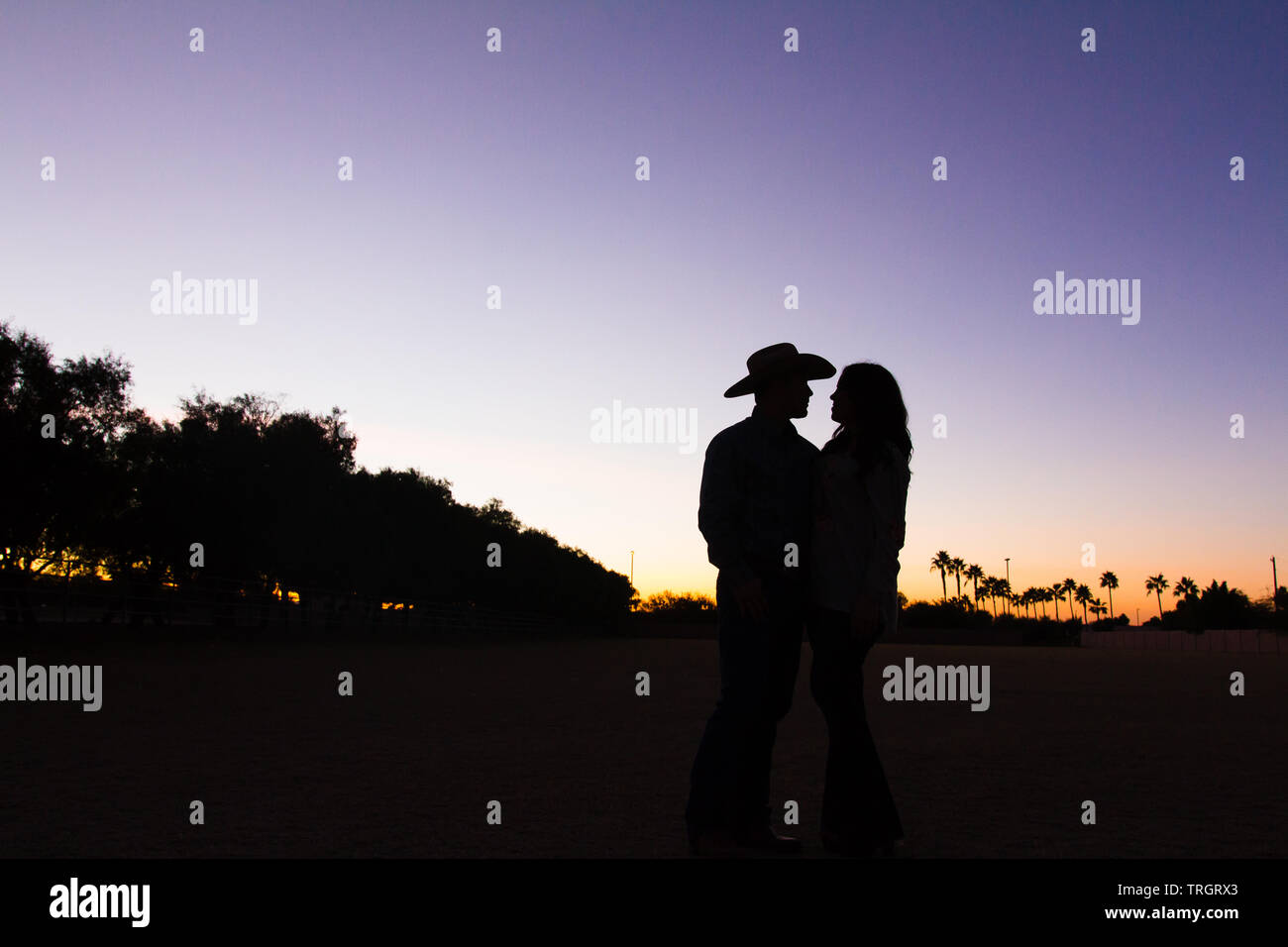 Country Family in the sunset dancing and jumping Stock Photo