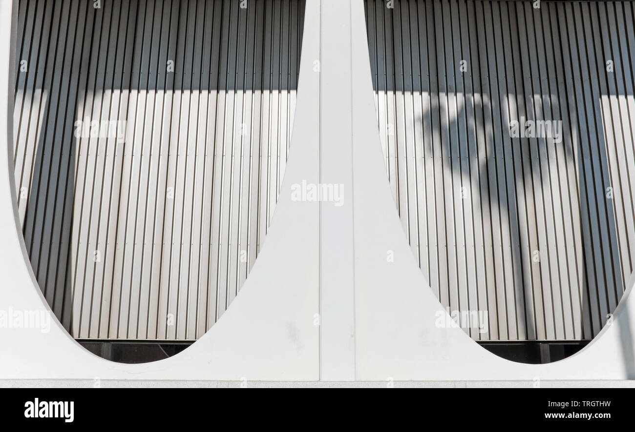 Shadow of a palm tree is projected on the mid-century modernist architecture of the landmark Chase Bank building in Palm Springs, California. Stock Photo