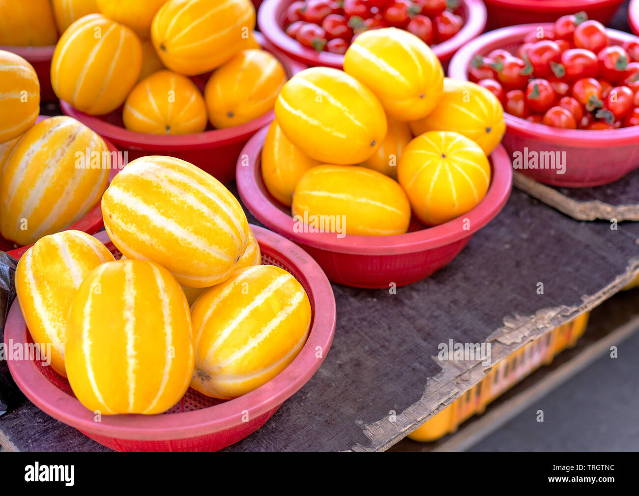 Delicious korean stripe yellow melon fruit food in red plastic basket