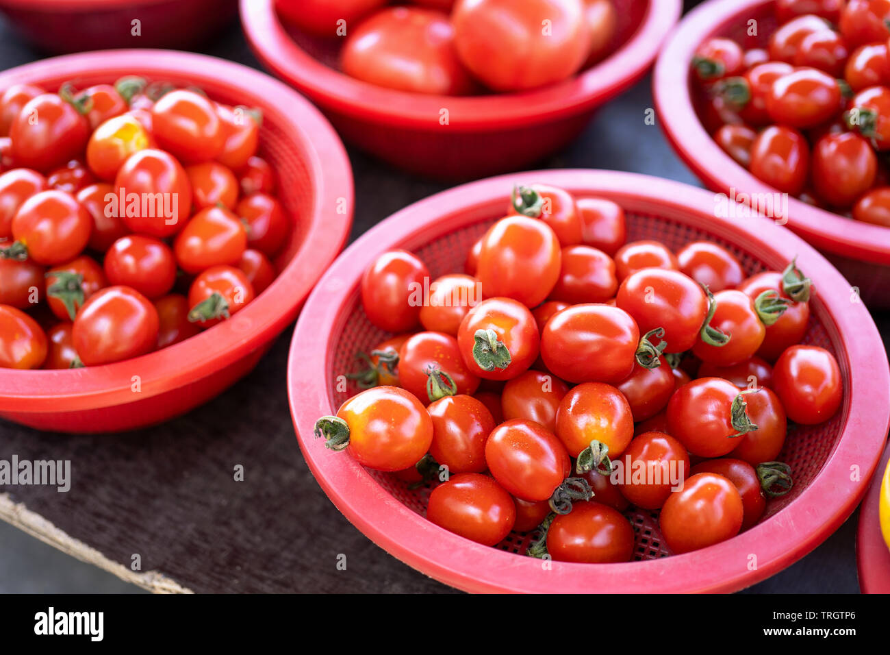 Delicious fresh tomatoes fruit vegetable food in red plastic basket at ...