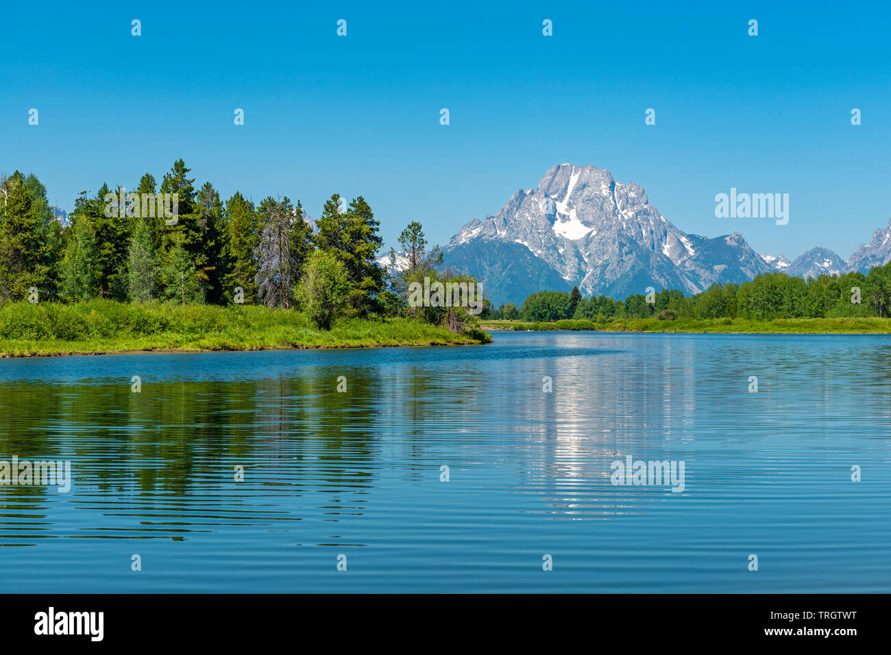 The majestic peaks of the Grand Tetons with a reflection in the Snake River by the Oxbow Bend, Grand Teton national park, Wyoming, USA. Stock Photo