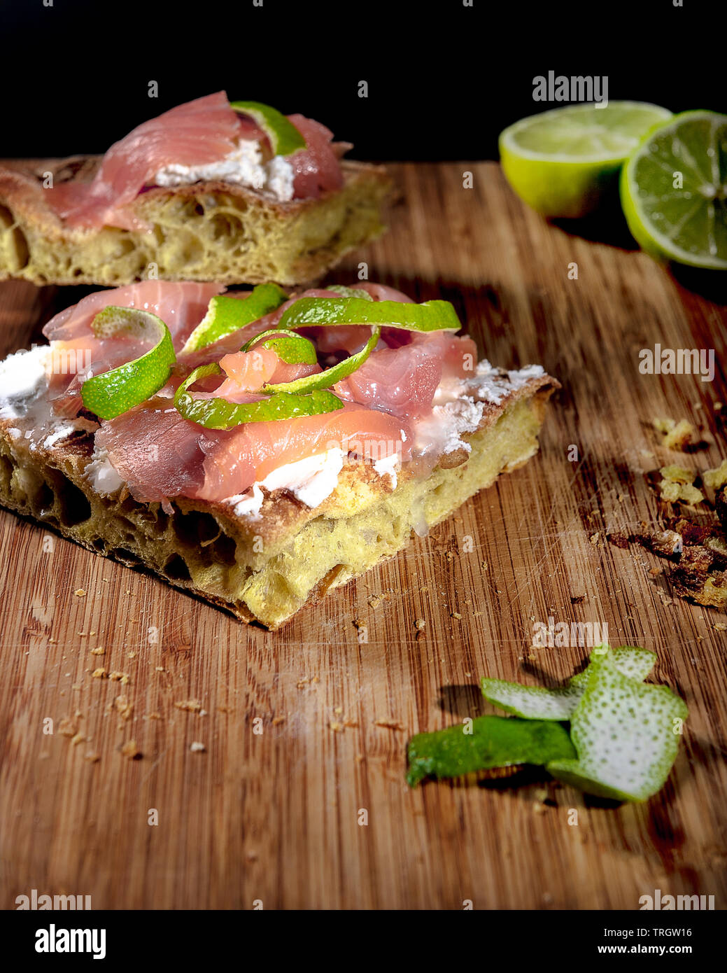 Pizza with salmon, fresh cheese and lime souce Stock Photo