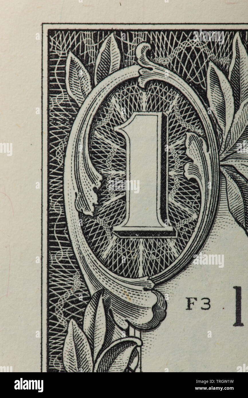 Front of a 1 dollar bill with focus on the 1 in the corner Stock Photo
