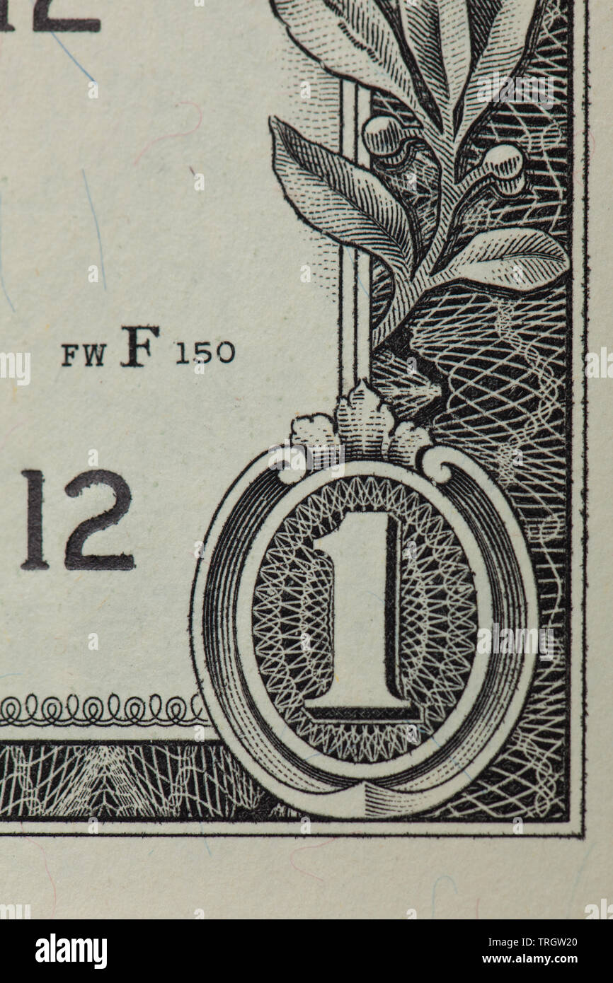 Front of a 1 dollar bill with focus on the 1 in the corner Stock Photo