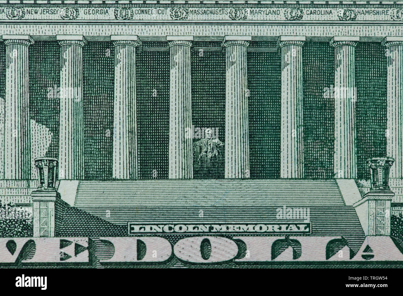 Back of a five dollar bill with focus on the Lincoln Memorial Stock Photo