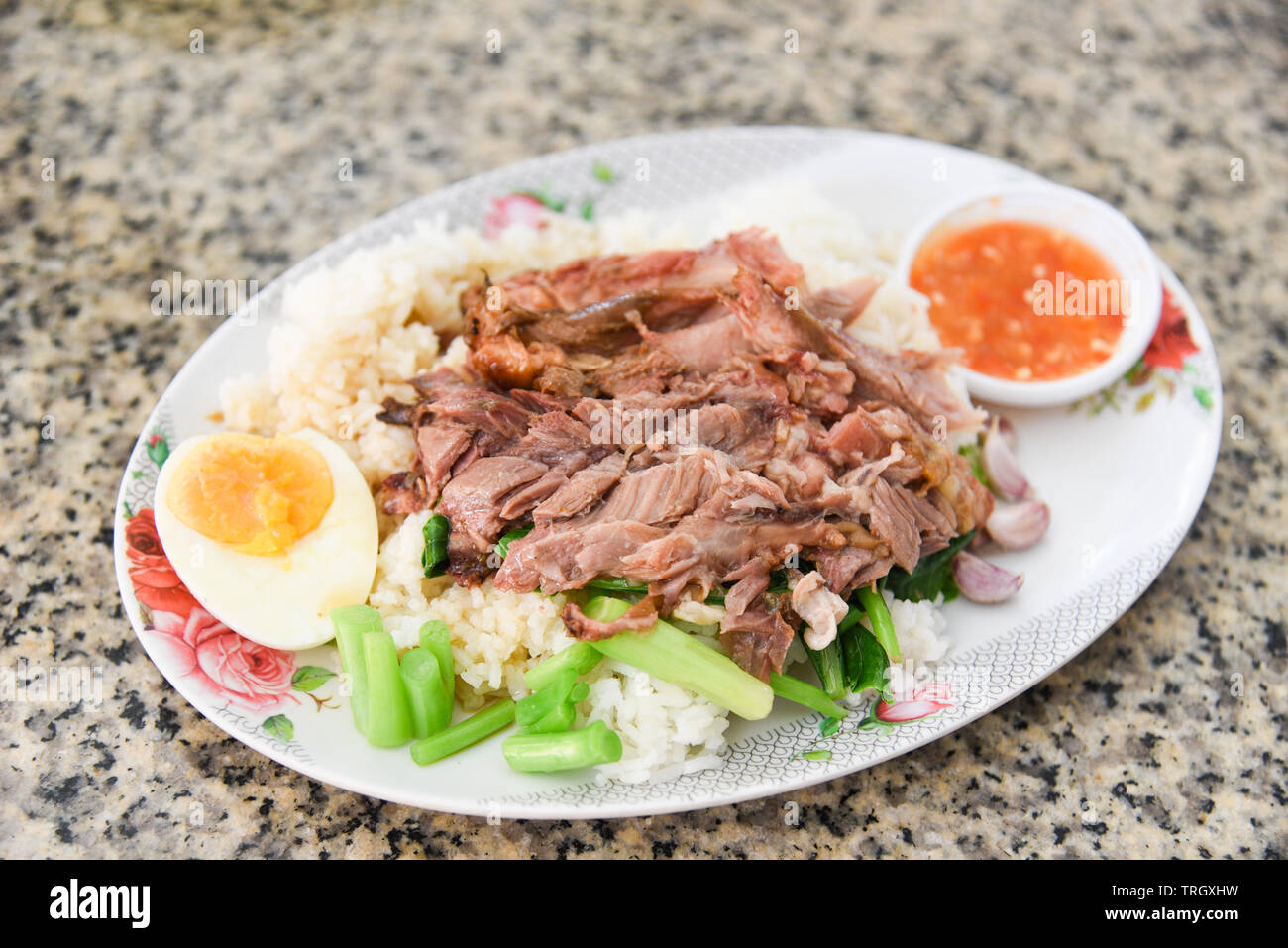 Stewed leg pork and Chinese Kale with sweet gravy sauce style chinese food on plate with egg Stock Photo